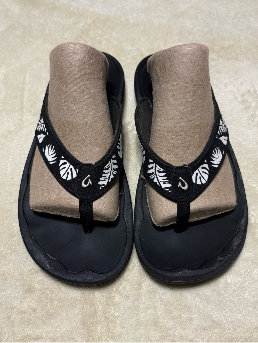 OluKai Black Sandals with White Tropical Leaf Accents